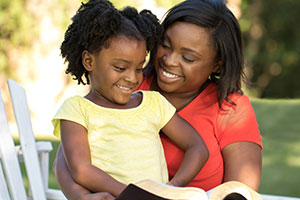 Woman reading with child